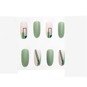 Detail of matte green and geometric line pattern almond press-on nails on white background