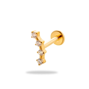 Titanium gold lip stud with four vertical clear zircons on a white background