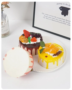 Detailed view of 10cm faux mousse cakes with realistic cream texture and fruit toppings