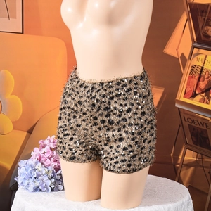 Detail of leopard print sequins shorts with plush knit texture and silver embellishments