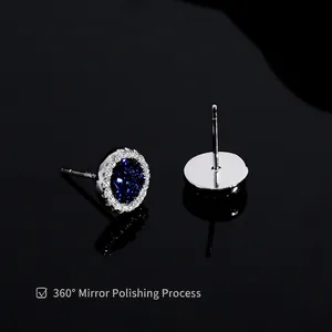 Blue crystal stud earrings for men in polished silver with shimmering halo accents