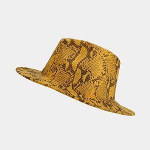 Close-up of yellow and black snakeskin pattern on a stylish wool fedora hat