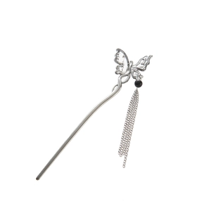 Close-up of silver butterfly hair stick with delicate metallic fringe and black bead