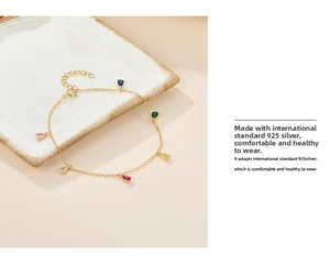 Detail of S925 silver gold-plated chain with pear-cut multi-color cubic zirconia stones