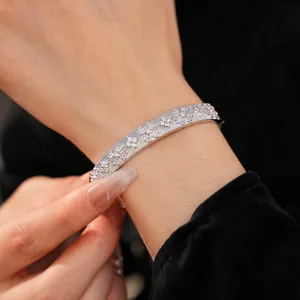 Silver bangle featuring zircon floral clover patterns and luxury sparkling star motifs