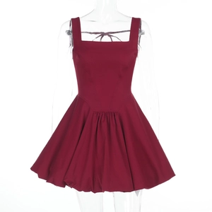 Detail of dark red square neck dress featuring lace-up open back and flared puff skirt