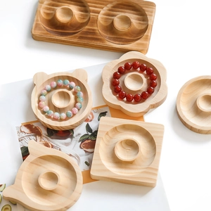 Close-up of assorted natural wooden jewelry trays for DIY bracelet design and display