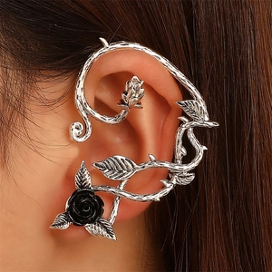 Gothic rose vine ear cuff with black 3D flower and silver leaves on model's ear