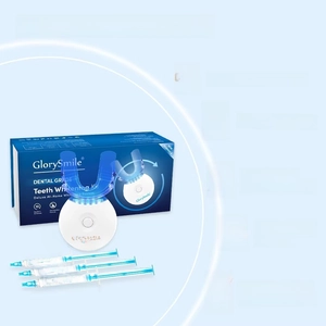 Teeth whitening kit with LED device, gel syringes and tray in professional packaging