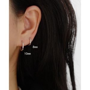 Detailed comparison of 8mm and 10mm S925 sterling silver hoop earrings on model ear