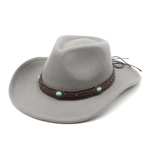 Detail of grey felt cowboy hat with leather band and turquoise stone embellishments