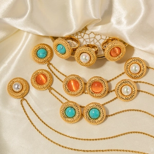 Elegant 18k gold heart and round pendant earrings with turquoise and pearls on silk