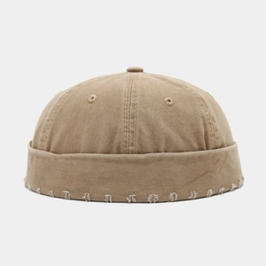 Bonnet docker kaki style vintage délavé avec détails de déchirures sur le bord