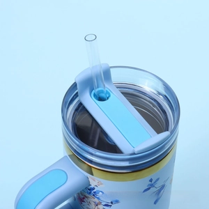 Top view of floral 304 stainless steel tumbler lid with straw and ergonomic handle