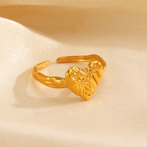Minimalist gold heart-shaped open ring with textured muscular design on satin background