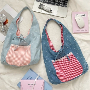 Detail of canvas tote bags with bow ribbon, gingham pockets and lace trim accents