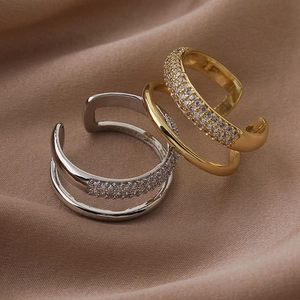 Detail of double-layer open ring featuring polished finish and micro-pave cubic zirconia
