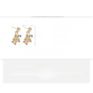 Detailed view of rhinestone bear earrings with silver needles and measurement specs