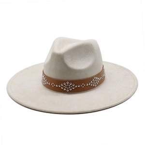 Off-white wide brim fedora hat with a brown leather studded band in western style