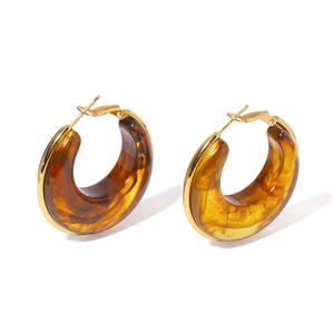 Fashionable amber resin hoop earrings with golden titanium steel finish in a C-shape