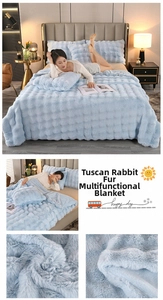 Detail of Tuscany style thick faux rabbit fur blanket with 3D plaid texture in light blue