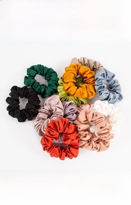 Close-up of multicolored 19mm silk scrunchies set with soft natural satin texture