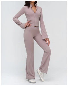 Detail of high-waist V-shape waistband and side pocket on yoga flare leggings