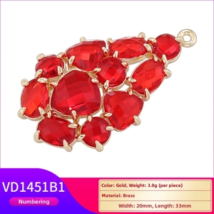 Elegant gold brass grape cluster pendant with faceted red glass leaf-shaped charms