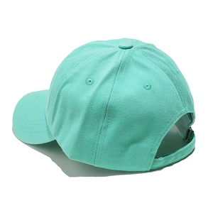 Detail of adjustable metal buckle and strap on mint green cotton baseball cap