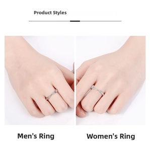 Detail of silver couple rings showing the plain men's band and diamond-set women's band