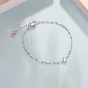 Minimalist silver stainless steel bracelet with a sparkling round zircon and lobster clasp
