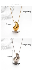 Macro detail of gold and silver teardrop pendants with polished hammered metal finish