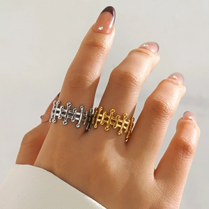 Fashionable geometric hollow stainless steel rings in gold and silver for women