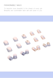 Detail of short square press-on nails with lavender hearts and gold foil accents