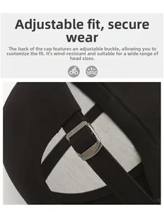 Detail of adjustable metal buckle on a black cotton baseball cap for a secure custom fit
