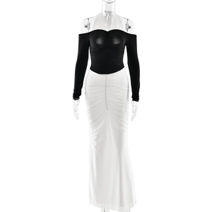 Elegant backless halter dress in black and white contrast with pleated detail