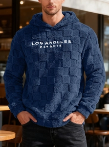 Detail of Los Angeles embroidery on navy blue fleece hoodie with checkerboard texture