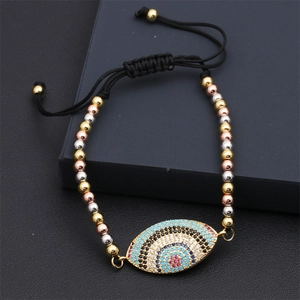 Detailed shot of evil eye bracelet with colorful zircons and tricolor metallic beads