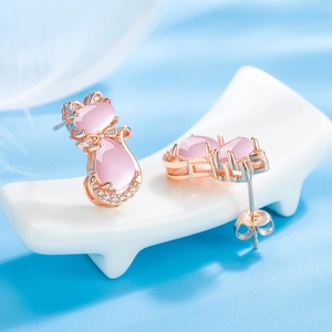 Elegant rose gold cat stud earrings with pink opal stones and sparkling crystal accents