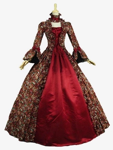 Detail shot of Victorian palace style dress featuring red satin and vintage floral patterns