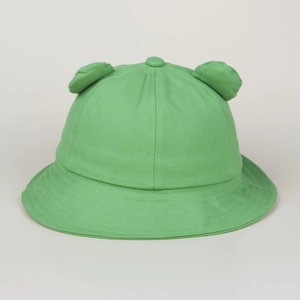 Detail view of green frog bucket hat with 3D eye decorations and fine cotton stitching