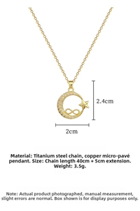 Macro detail of gold moon and star pendant with cubic zirconia and chain specs