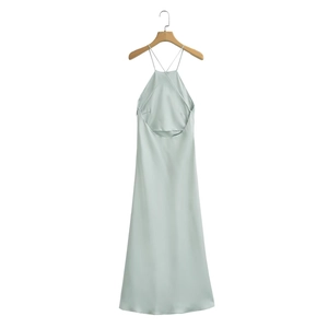 Detail view of mint green satin maxi dress with silky texture and halter neck design