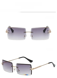Detail view of gold-grey rimless rectangular sunglasses with purple gradient lenses