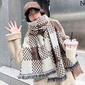 Brown and beige checkerboard plaid cashmere scarf with tassel edges worn by model