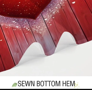 Close-up of sewn bottom hem detail on a red heart pattern bathroom shower curtain