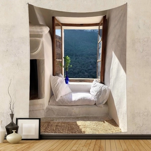 Detailed view of bohemian wall tapestry featuring a serene Mediterranean window landscape