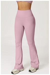 Close-up of light pink high-waisted flared yoga pants in premium matte elastic fabric