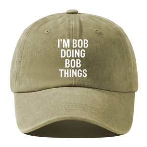 Vintage khaki washed cotton baseball cap with humorous I'M BOB DOING BOB THINGS text