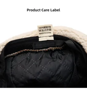 Detailed view of winter beret inner lining with care label showing material specifications